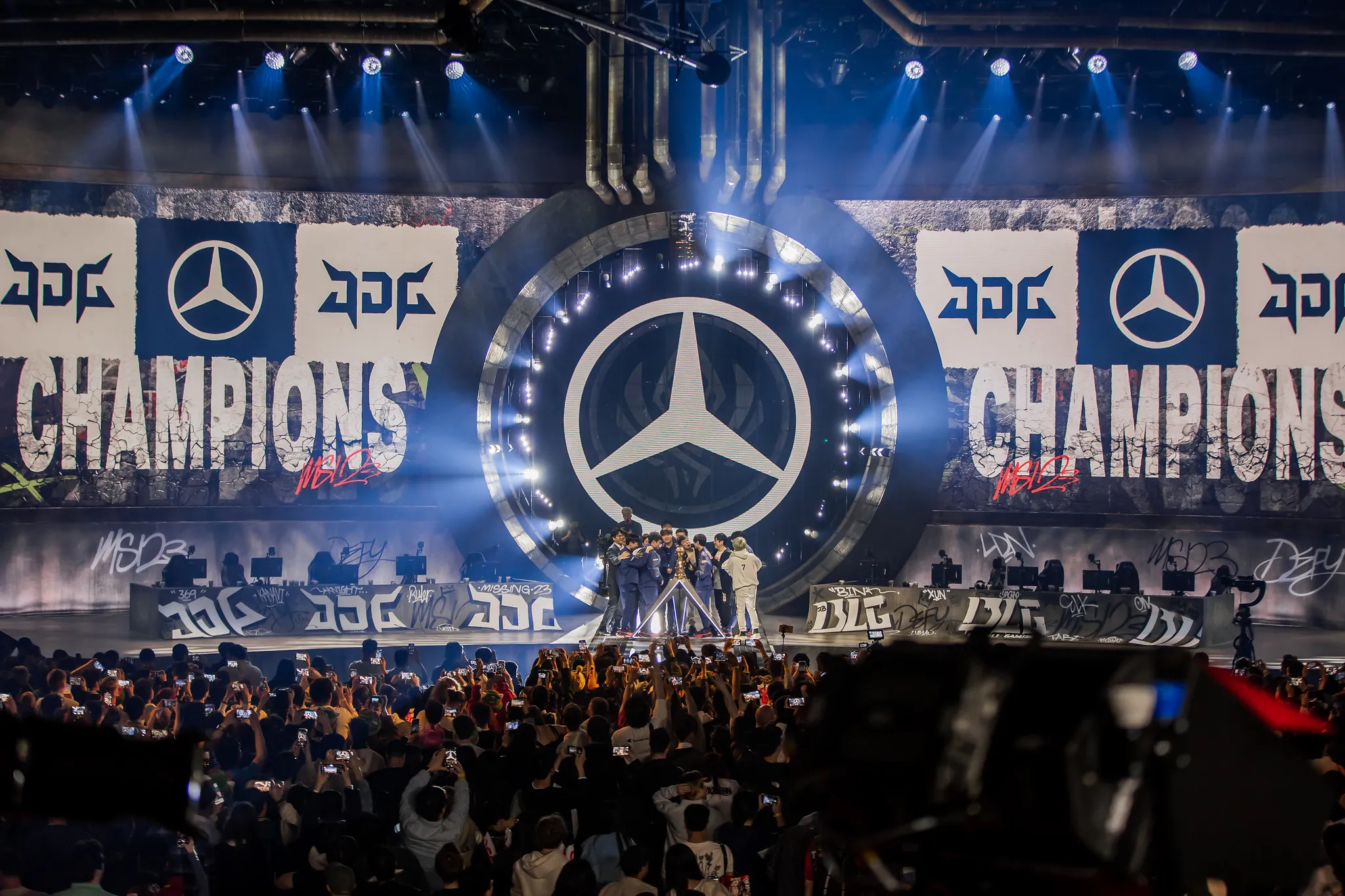 JDG hoists the MSI trophy.